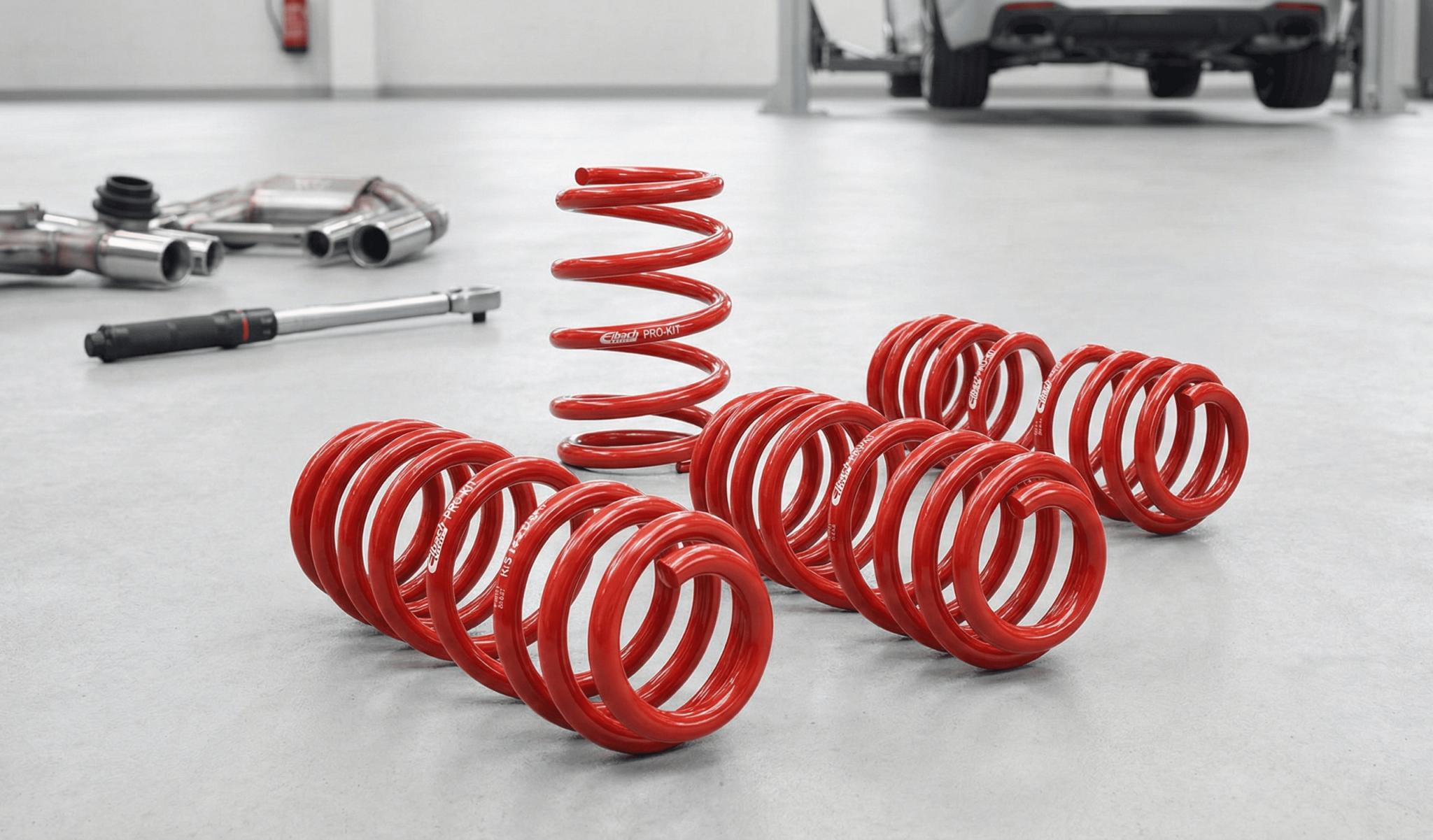 A bunch of red springs sitting on top of a floor